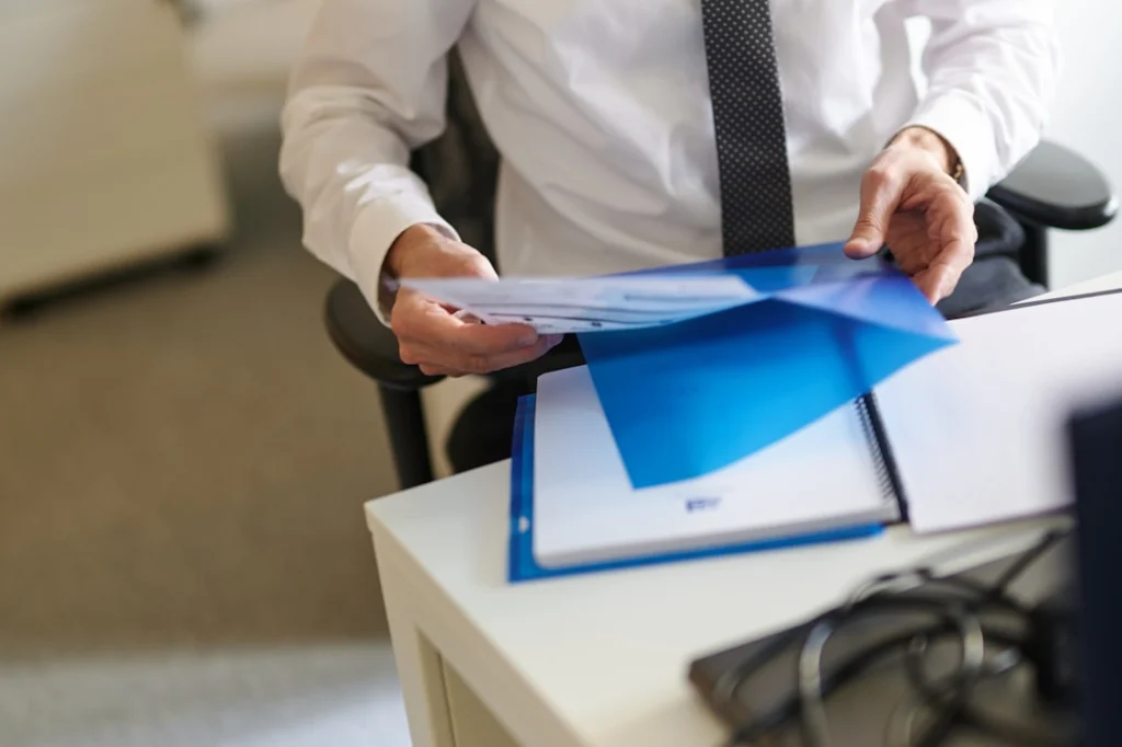 Professional reviewing legal and compliance documentation in an office setting